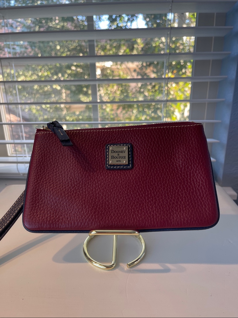 Dooney & Bourke Burgundy Pebbled Leather Wristlet with Gold Plaque